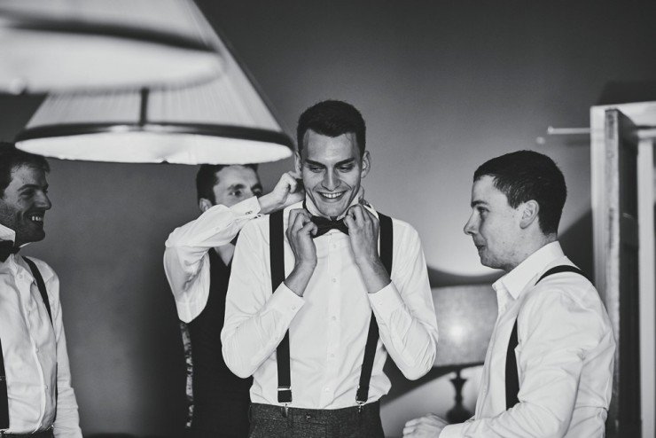groom and ushers getting ready in billiards room at Devon wedding venue Rockbeare Manor