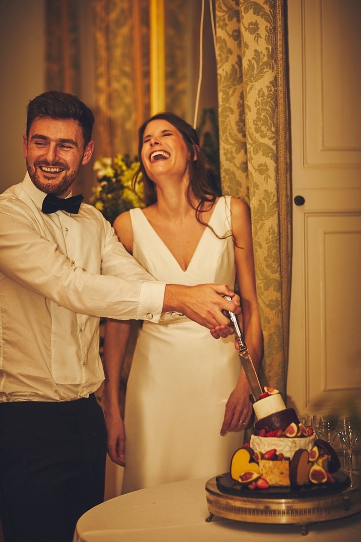 cake cutting at intimate winter wedding at Rockbeare Manor in Devon